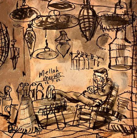 The tin lamp merchant in the mellah of Marrakech checks his iPhone messages